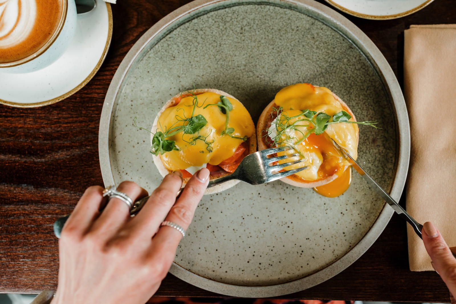 Brunch dish with poached eggs from The Charleston menu